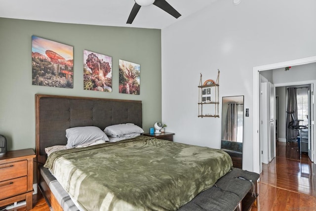 bedroom with ceiling fan, lofted ceiling, and hardwood / wood-style floors