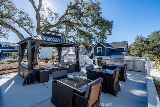 view of patio / terrace featuring a gazebo, outdoor lounge area, and area for grilling