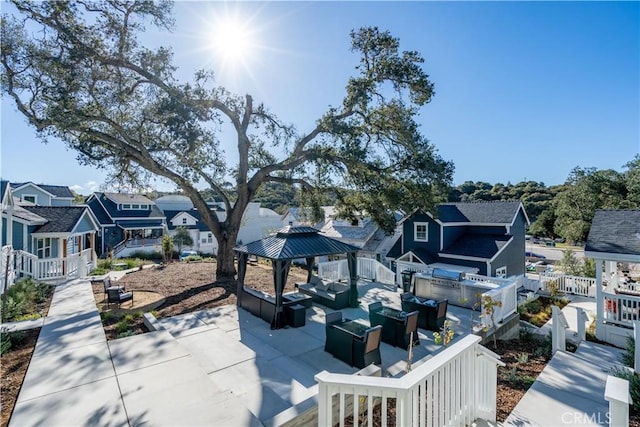 view of patio / terrace with an outdoor hangout area and a gazebo