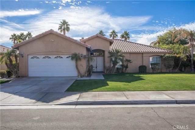 view of front of property with a front lawn and a garage