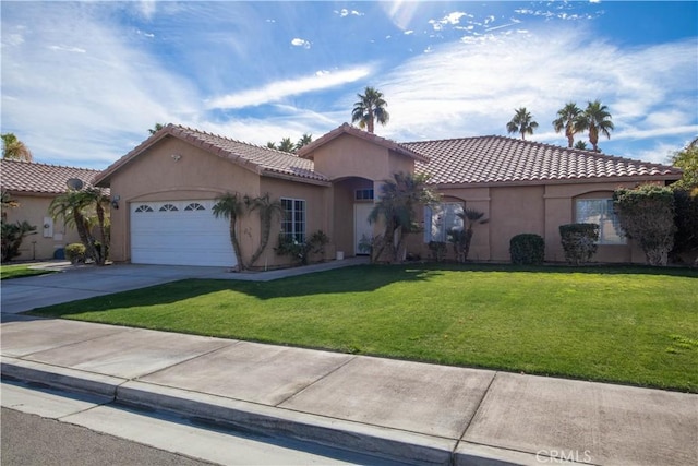 mediterranean / spanish-style house with a front lawn and a garage