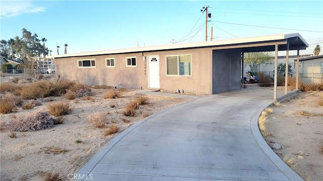 view of front of home featuring a carport