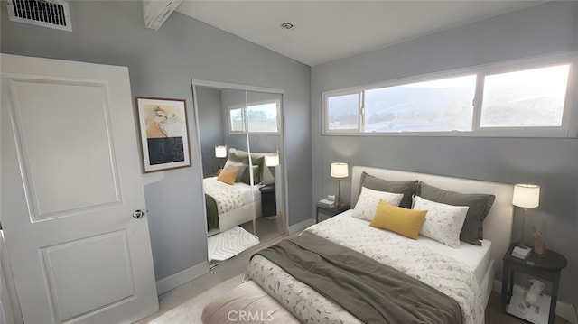 bedroom with a closet and lofted ceiling