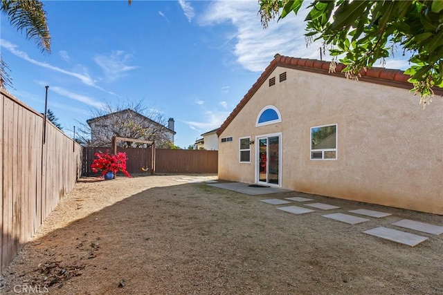 back of property with a patio area