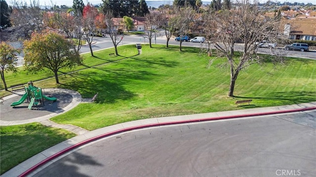 view of home's community with a playground