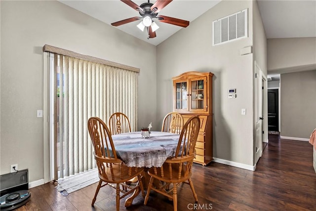 dining room with vaulted ceiling, dark wood-type flooring, and ceiling fan