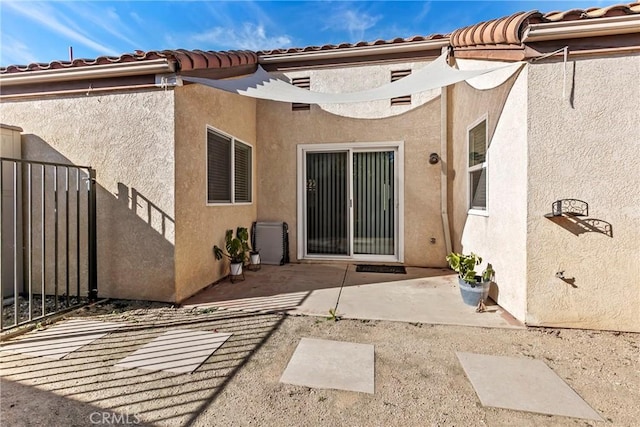 back of house with a patio area