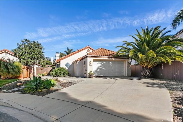 mediterranean / spanish house featuring a garage