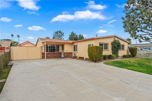 ranch-style house with a front lawn