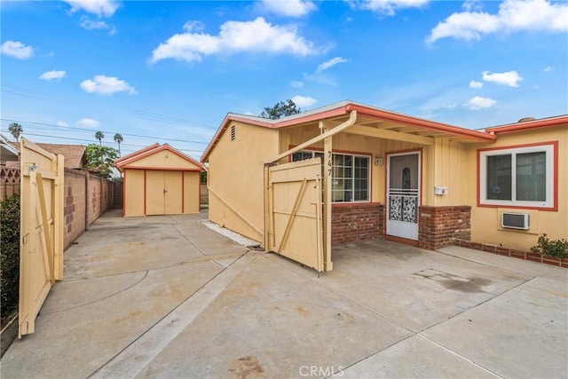 exterior space with a shed