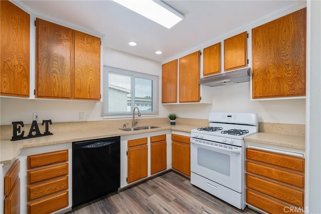 kitchen with black dishwasher, hardwood / wood-style floors, white gas range oven, and sink