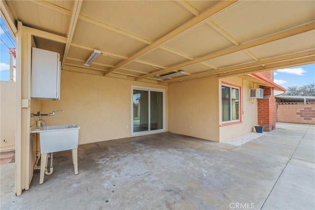 view of patio / terrace with a wall mounted air conditioner