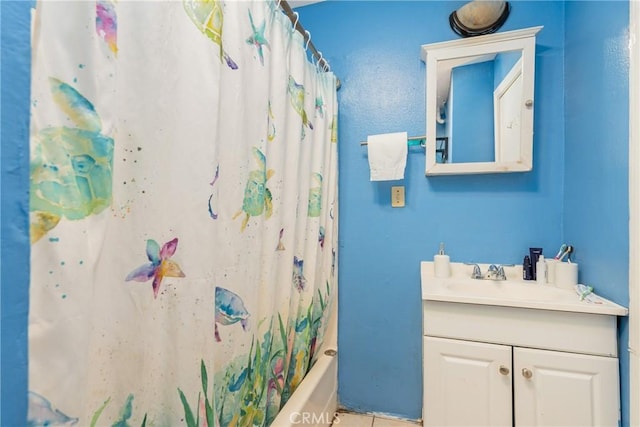 bathroom featuring tile patterned floors, vanity, and shower / bath combo