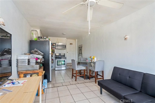 tiled living room featuring ceiling fan