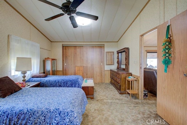 bedroom featuring vaulted ceiling, ceiling fan, and carpet floors