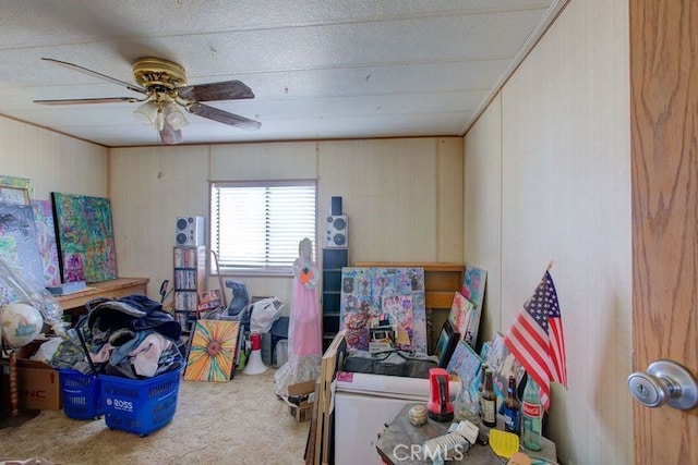 interior space with ceiling fan and carpet