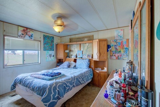 bedroom featuring ceiling fan and carpet floors