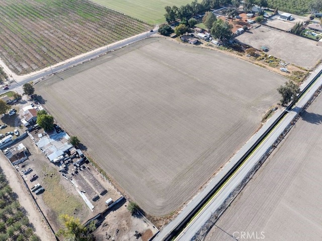 birds eye view of property featuring a rural view