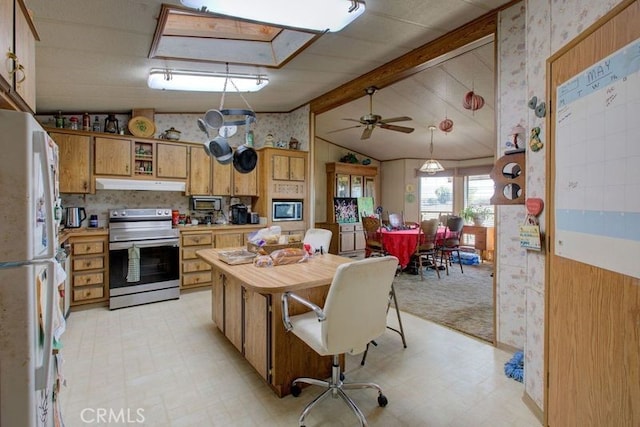 kitchen with ceiling fan, lofted ceiling with beams, appliances with stainless steel finishes, and pendant lighting