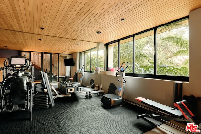 exercise room featuring wood ceiling