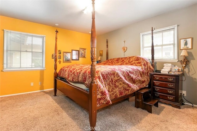 bedroom featuring light carpet