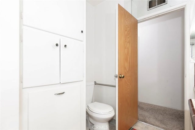 bathroom featuring toilet