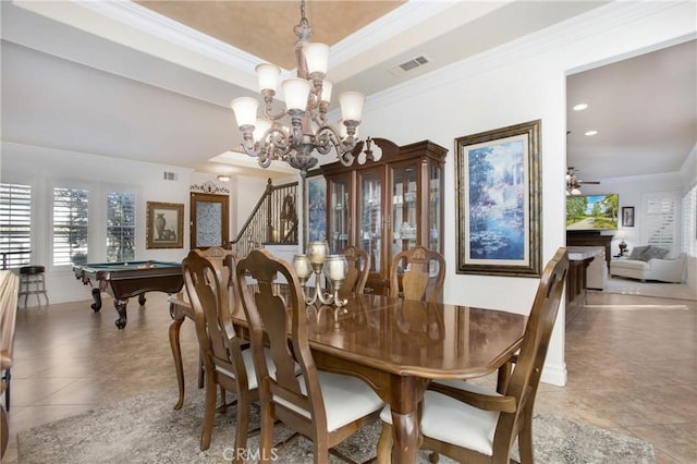 tiled dining area featuring ornamental molding, billiards, ceiling fan with notable chandelier, and a tray ceiling