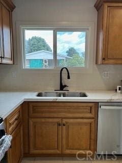 kitchen featuring sink, a wealth of natural light, and dishwasher