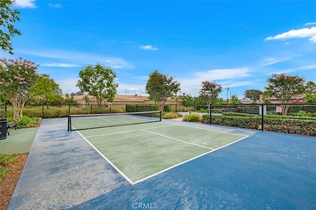 view of tennis court featuring basketball court