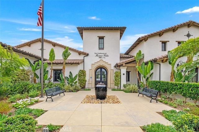 rear view of property with french doors