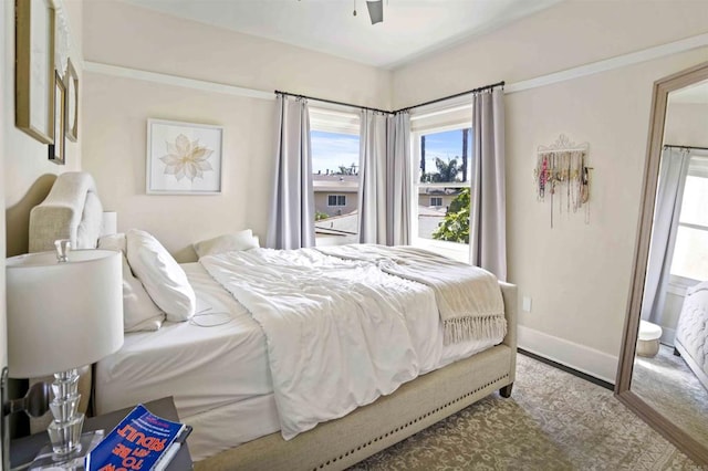 bedroom with ceiling fan and ensuite bathroom