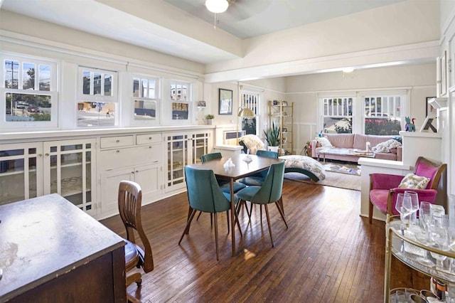 dining space with ceiling fan and dark hardwood / wood-style flooring