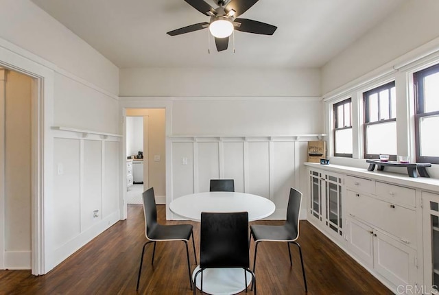 dining space featuring ceiling fan and dark hardwood / wood-style flooring