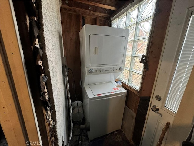 laundry room with stacked washer and clothes dryer