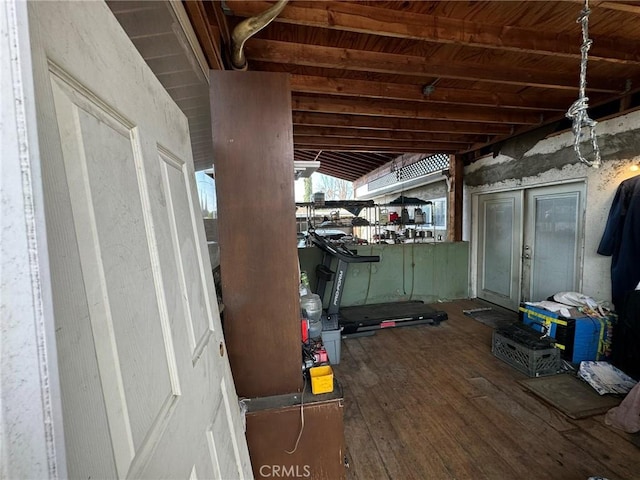 basement with dark hardwood / wood-style flooring