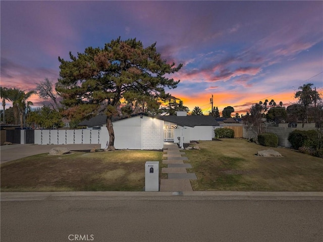 view of front of home with a lawn