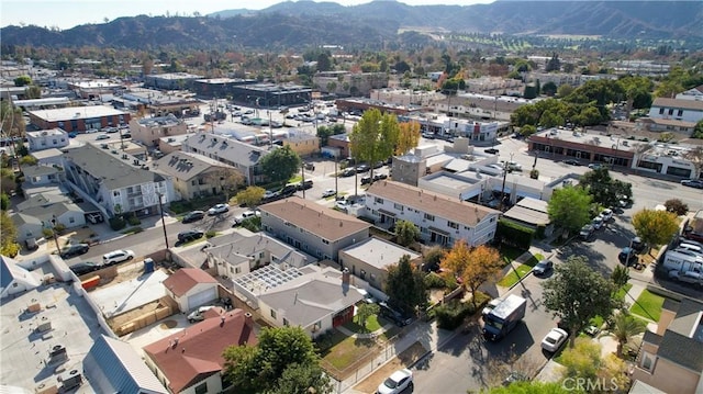 birds eye view of property featuring a mountain view