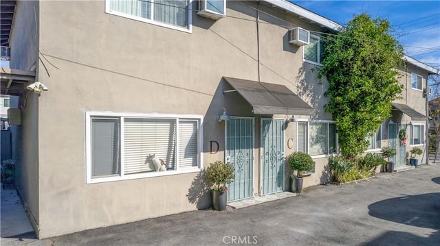 exterior space with a wall unit AC