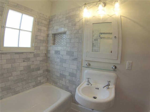 bathroom with sink and a bathing tub