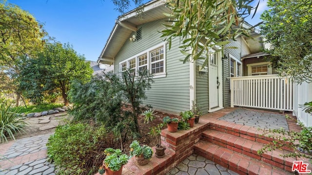 view of property exterior with a porch