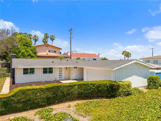 single story home featuring a garage