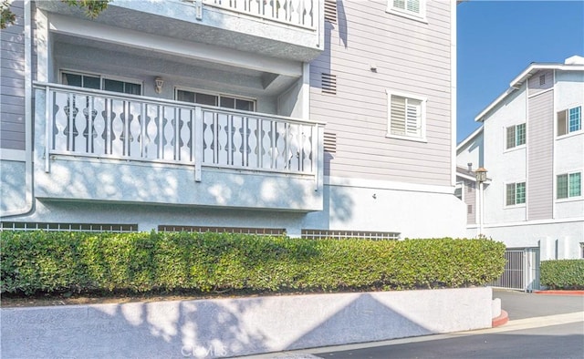 view of property exterior with a balcony