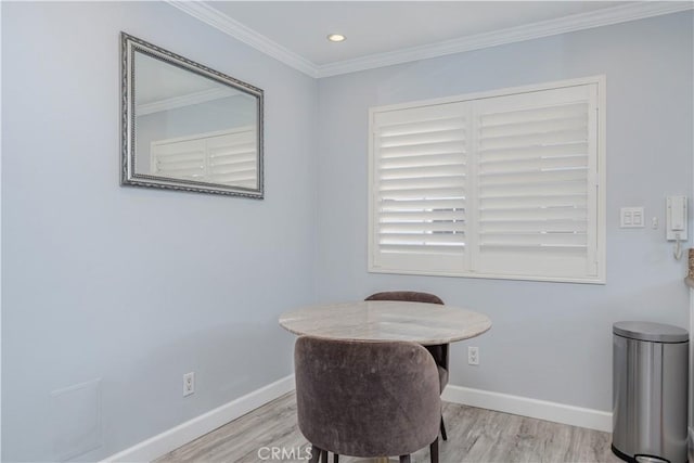 office with ornamental molding and light wood-type flooring