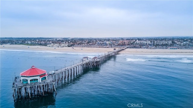 bird's eye view featuring a water view and a view of the beach