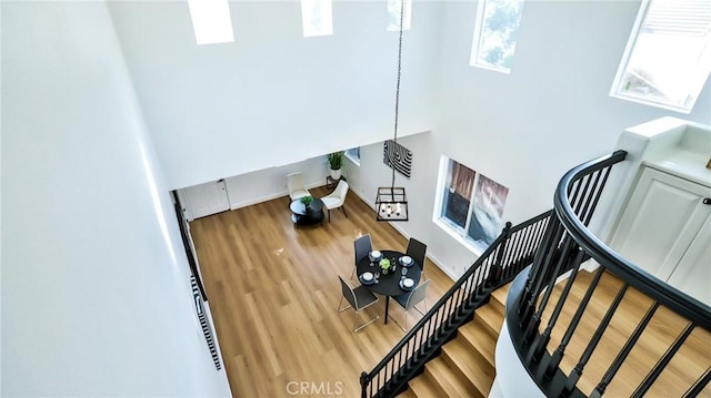 stairs featuring hardwood / wood-style flooring