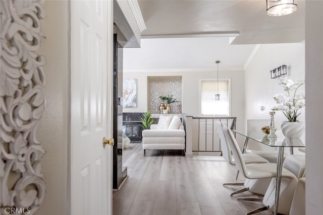 interior space featuring hardwood / wood-style floors and ornamental molding