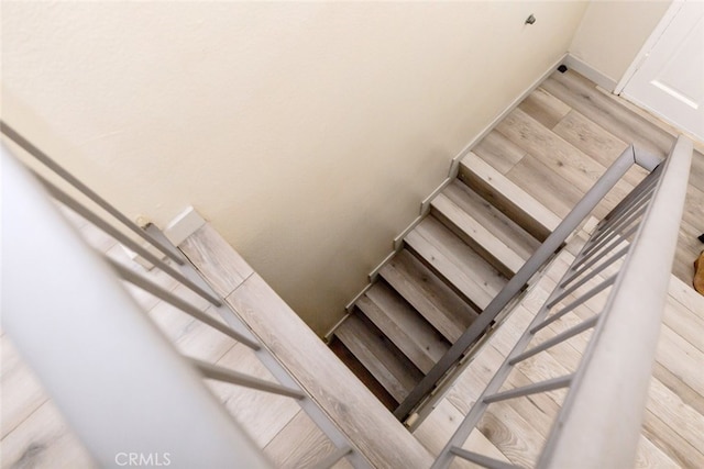 stairs with wood-type flooring