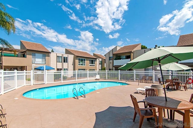 view of swimming pool with a patio area