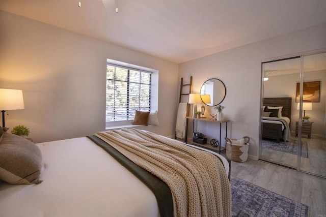 bedroom featuring hardwood / wood-style floors and a closet