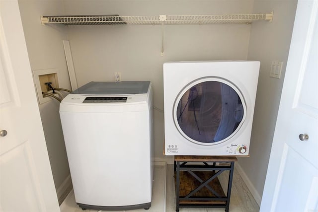 washroom featuring separate washer and dryer